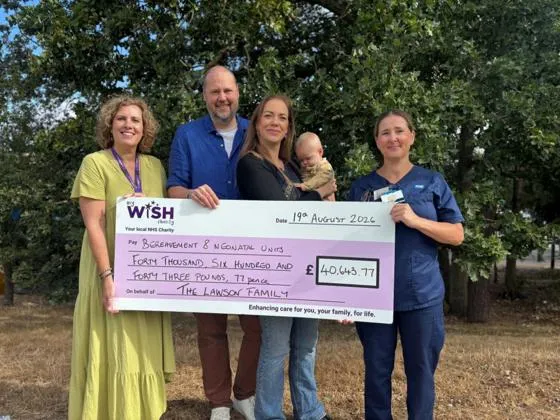 Rhiannon mike and lochlan handing over a giant cheque for £40,643.77